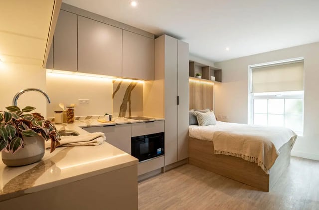 Modern studio kitchen with bed and window studio at Yugo Rothesay House in Bournemouth Student Accommodation