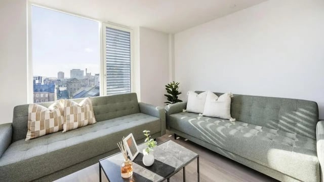Two grey sofas with cushions and coffee table living room at Parklands in Dundee Student Accommodation