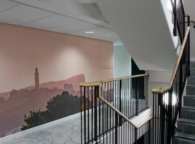 Wall mural and staircase with black railings Corridor at Parklands in Dundee Student Accommodation