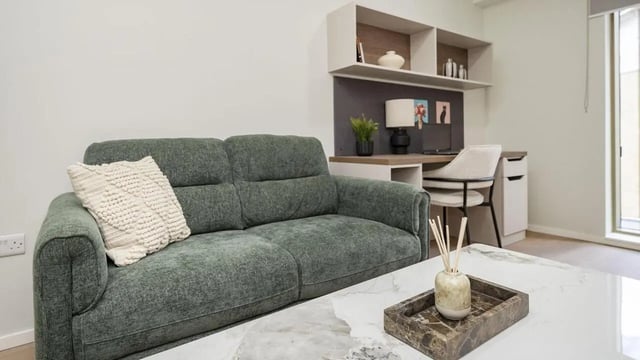 Sofa desk and shelves living room at Broadway Studios in Glasgow Student Accommodation