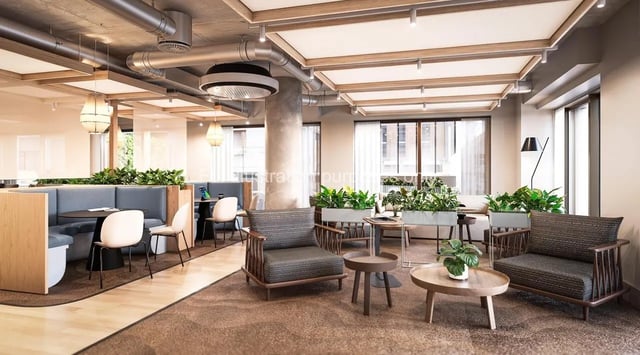 Chairs couches tables and plants communal area at Broadway Studios in Glasgow Student Accommodation