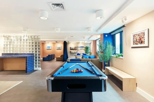 Pool table couches glass block wall communal area at Hollis Wharf in Bath Student Accommodation