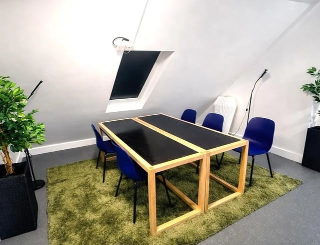 Table chairs plant rug dining area at Hollis Wharf in Bath Student Accommodation