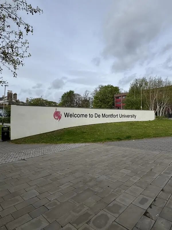Welcome sign grass and paving exterior at Mintworks in Leicester Student Accommodation