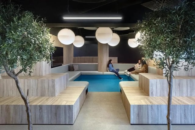 Seating area with blue pool and trees Living room at Copley Court in Cork Student Accommodation