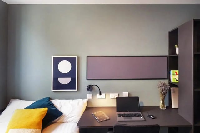Bed pillows artwork laptop and desk bedroom at Copley Court in Cork Student Accommodation