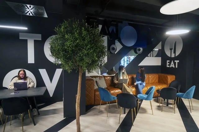 Students working and relaxing in common area lounge at Copley Court in Cork Student Accommodation