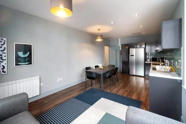 Modern living room with dining table kitchen exterior at Copley Court in Cork Student Accommodation
