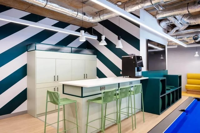 Island bar with stools coffee machine pool table communal area at Coleman Court in Cork Student Accommodation