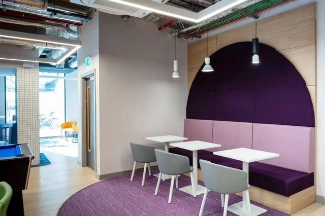 Purple booth seating tables and chairs lounge area at Coleman Court in Cork Student Accommodation
