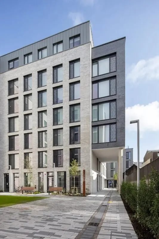 Modern building with benches and pathway exterior at Coleman Court in Cork Student Accommodation