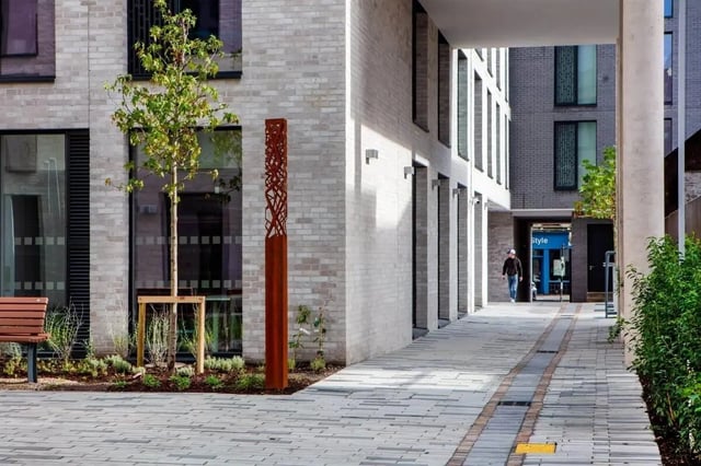 Modern brick building with pathway and bench exterior at Coleman Court in Cork Student Accommodation