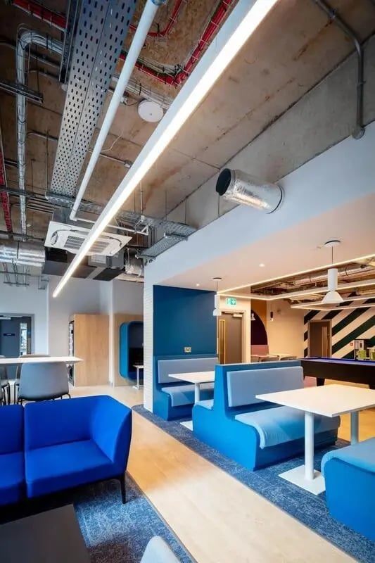 Blue couches booths tables and pool table common area at Coleman Court in Cork Student Accommodation
