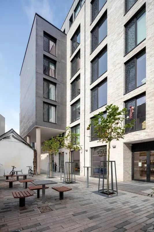 Wooden picnic tables and benches outdoor area exterior at Coleman Court in Cork Student Accommodation
