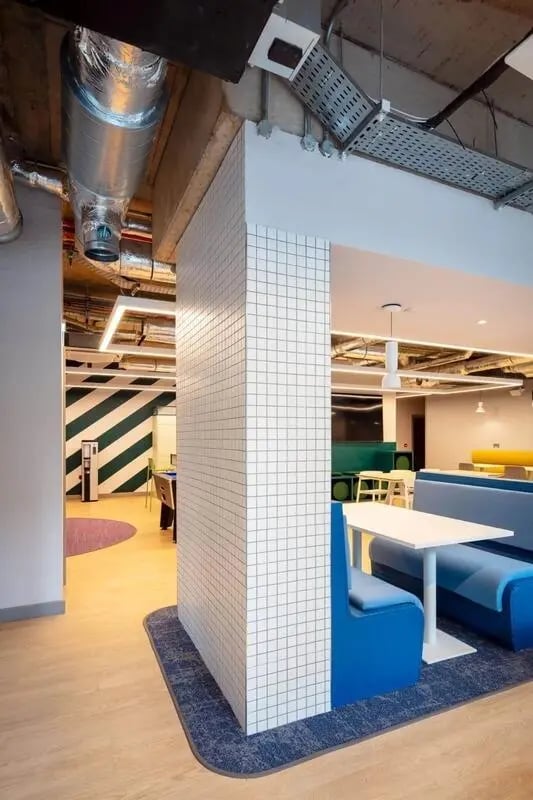 Blue booth seating with white table communal area at Coleman Court in Cork Student Accommodation