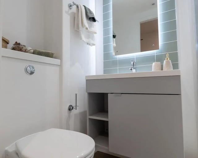 Toilet sink towels and mirror bathroom at The Artisan in Dublin Student Accommodation