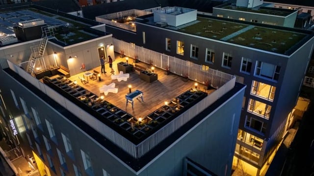 Rooftop with foosball table seating and plants exterior at The Artisan in Dublin Student Accommodation