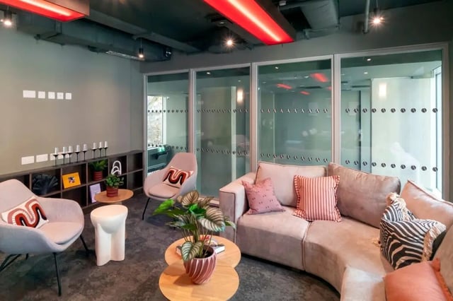 Sofa chairs tables and plants lounge area at The Artisan in Dublin Student Accommodation