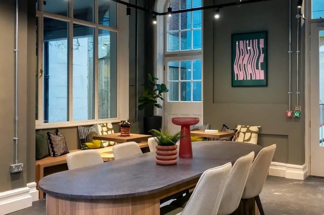 Dining table with plants and chairs living room at The Artisan in Dublin Student Accommodation