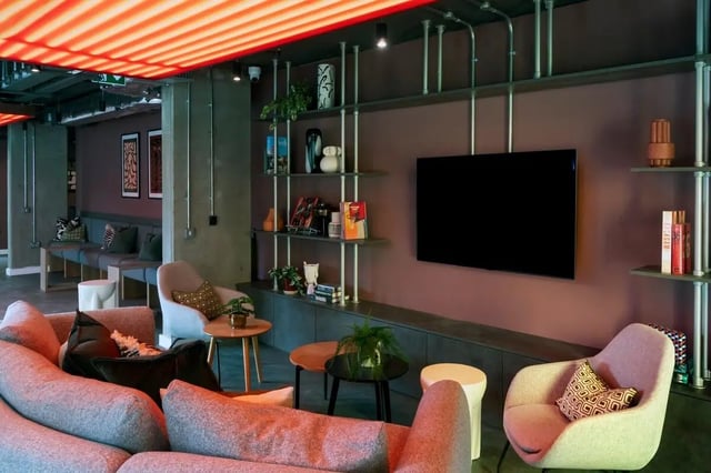 Large sofa chairs and TV in lounge living room at The Artisan in Dublin Student Accommodation