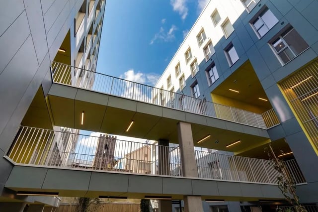 Modern building with walkways and blue sky exterior at The Artisan in Dublin Student Accommodation