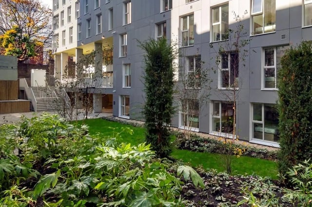 Modern building exterior with courtyard and greenery exterior at The Artisan in Dublin Student Accommodation