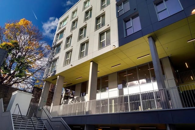 Modern student building with yellow overhang and windows exterior at The Artisan in Dublin Student Accommodation