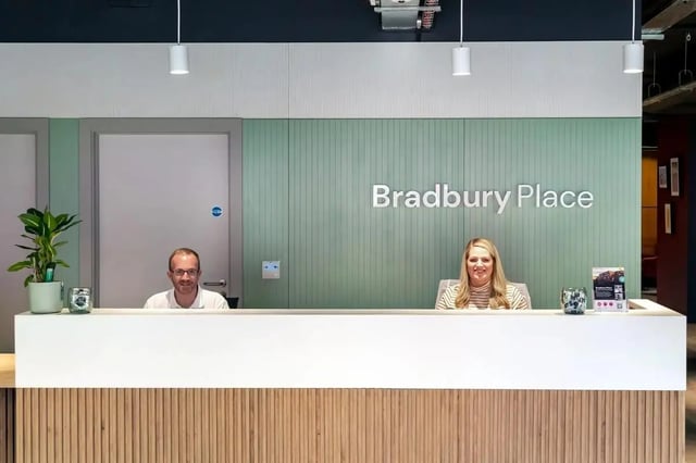 Staff at Bradbury Place reception desk reception at Bradbury Place in Belfast Student Accommodation