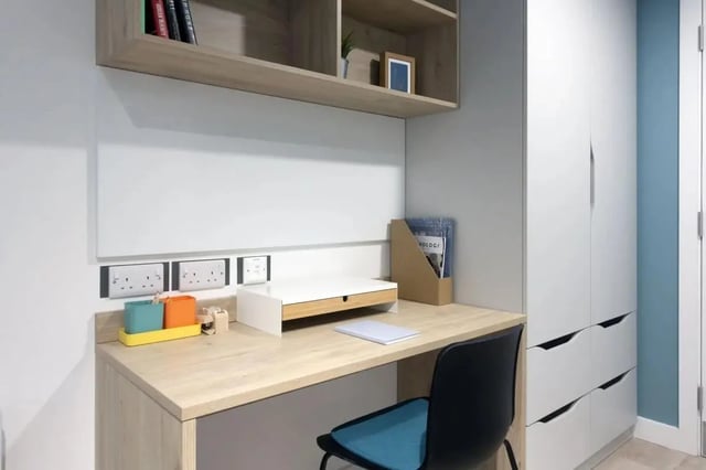Desk shelf chair and storage unit study area at Bradbury Place in Belfast Student Accommodation