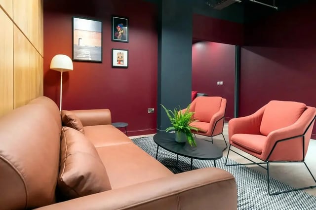 Brown sofa coral chairs coffee table living room at Bradbury Place in Belfast Student Accommodation