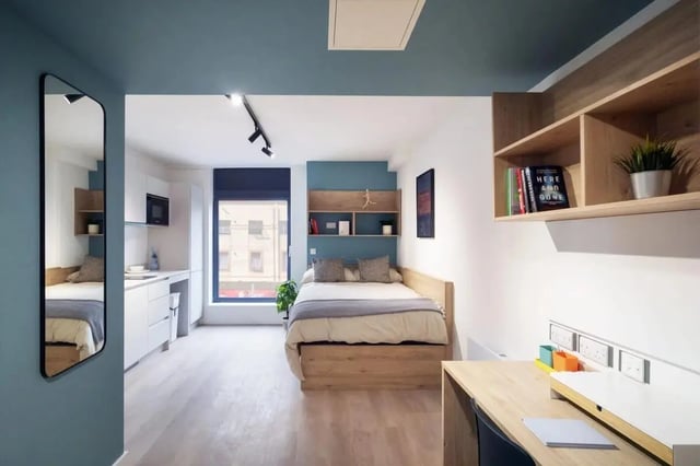 Bed kitchen desk and mirror student room at Bradbury Place in Belfast Student Accommodation