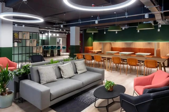 Modern communal area with sofas and dining tables living room at Bradbury Place in Belfast Student Accommodation