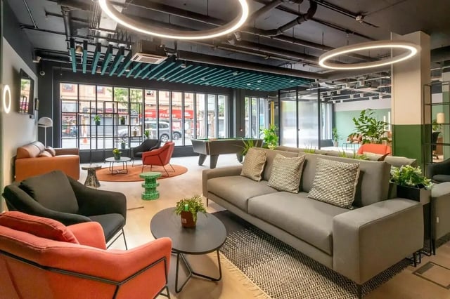Modern common room with pool table and seating living room at Bradbury Place in Belfast Student Accommodation