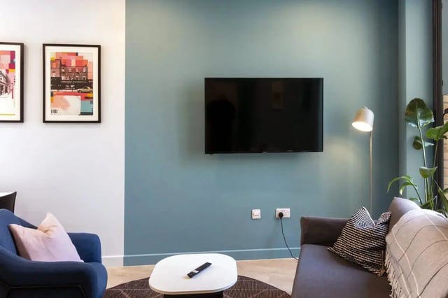 TV artwork blue armchair sofa living room at Stoneybatter Place in Dublin Student Accommodation