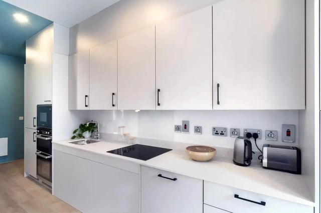 White cabinets sink stovetop kettle toaster kitchen at Stoneybatter Place in Dublin Student Accommodation