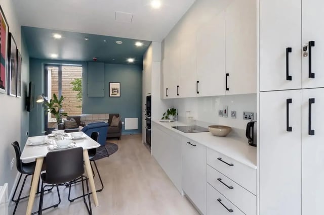 Dining area kitchen with modern white cabinets living room Image Type at Stoneybatter Place in Dublin Student Accommodation