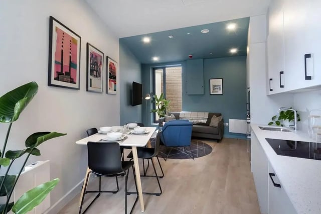 Dining table, chairs, sofa, kitchen living room at Stoneybatter Place in Dublin Student Accommodation