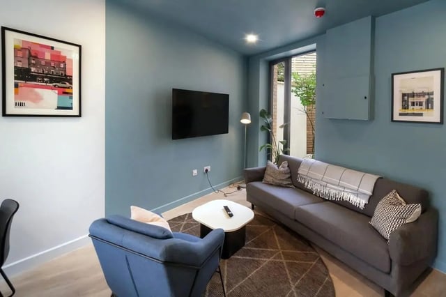 Sofa armchair TV coffee table art living room at Stoneybatter Place in Dublin Student Accommodation