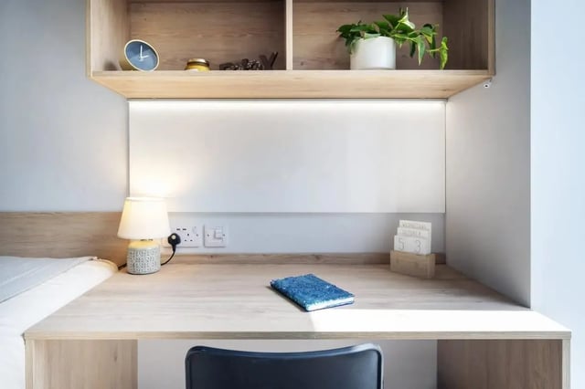 Desk lamp notebook calendar clock plant study area at Stoneybatter Place in Dublin Student Accommodation