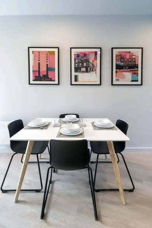 Dining table with place settings and artwork dining area at Stoneybatter Place in Dublin Student Accommodation
