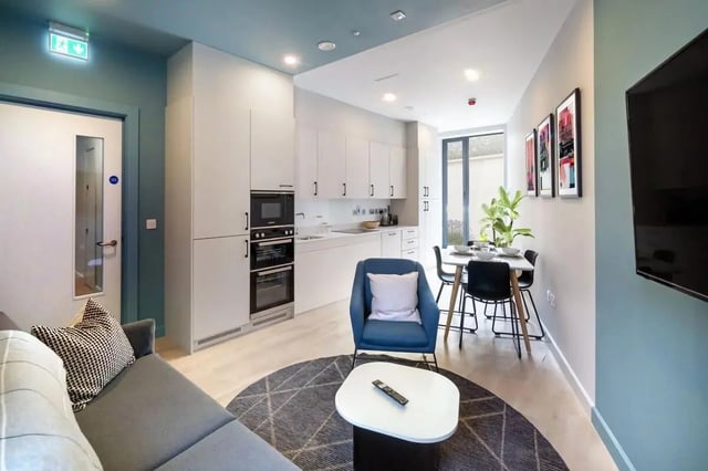 Sofa kitchen dining area with chairs and table Living room at Stoneybatter Place in Dublin Student Accommodation
