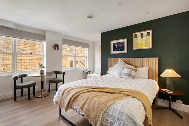 Bed chairs table and artwork bedroom at UKO Potts Point in Sydney Student Accommodation