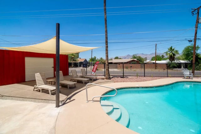Deck with lounge chairs and swimming pool exterior at Union on Bellevue in Tucson Student Accommodation