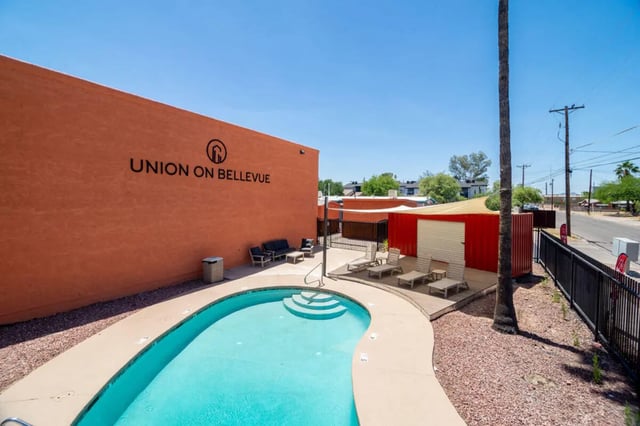 Pool with lounge chairs and outdoor seating exterior at Union on Bellevue in Tucson Student Accommodation