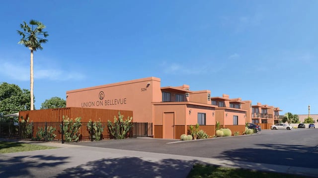 Orange buildings palm tree desert plants exterior at Union on Bellevue in Tucson Student Accommodation
