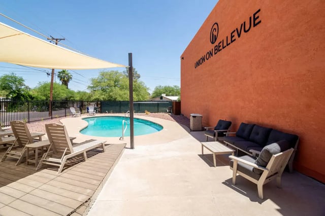 Pool lounge chairs and outdoor seating patio area at Union on Bellevue in Tucson Student Accommodation