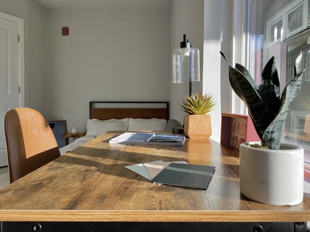 Desk chair bed plants desk bedroom study area at Ace Apartments in Seattle Student Accommodation