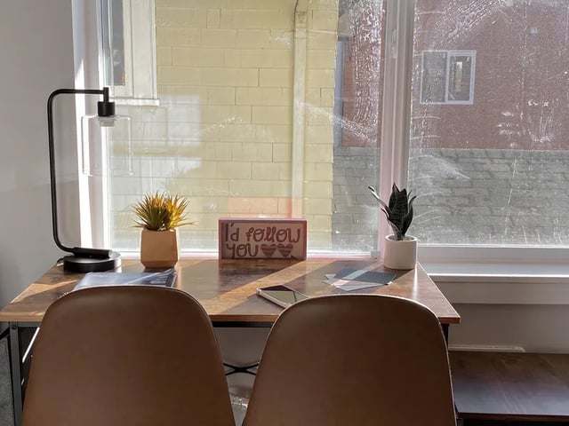 Desk with lamp plants and chairs study area at Ace Apartments in Seattle Student Accommodation