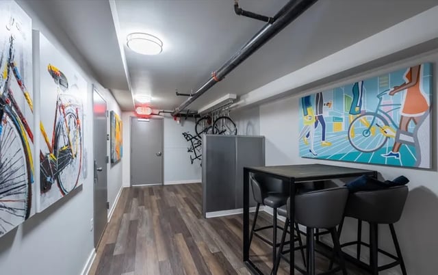 Artwork and bar table with chairs common area at Ace Apartments in Seattle Student Accommodation