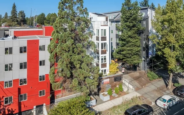 Modern apartments with red and gray exterior exterior at Ace Apartments in Seattle Student Accommodation